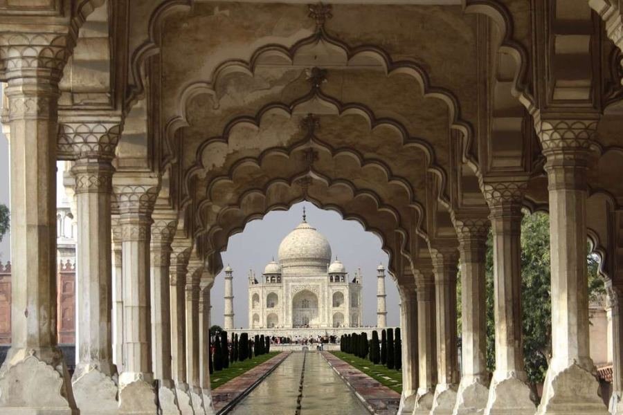 The Taj Mahal framed by scalloped marble arches