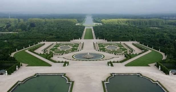 Aerial view of the Versailles gardens with the Latona Fountain and the Grand Canal stretching into the distance